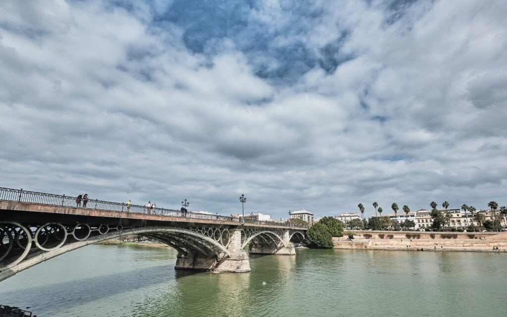 Triana Bridge in Seville crossing the Guadalquivir River, connecting the city centre with the Triana neighbourhood