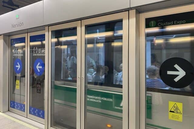 Seville metro train leaving a station
