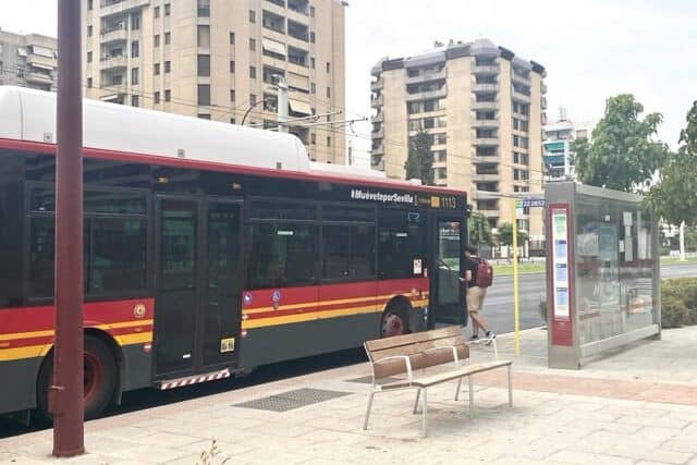 Seville bus waiting at a city bus stop in Nervion
