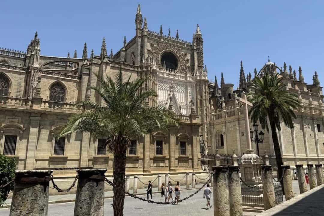 Exterior of Seville Cathedral with its Gothic arches and stone details